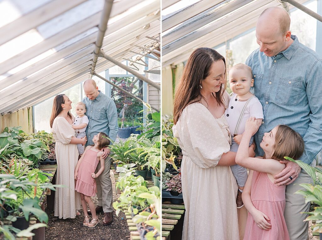 Augusta GA Family Photography - Family stand together and gaze at each other in greenhouse. Daughter reaches up to make her young brother smile.