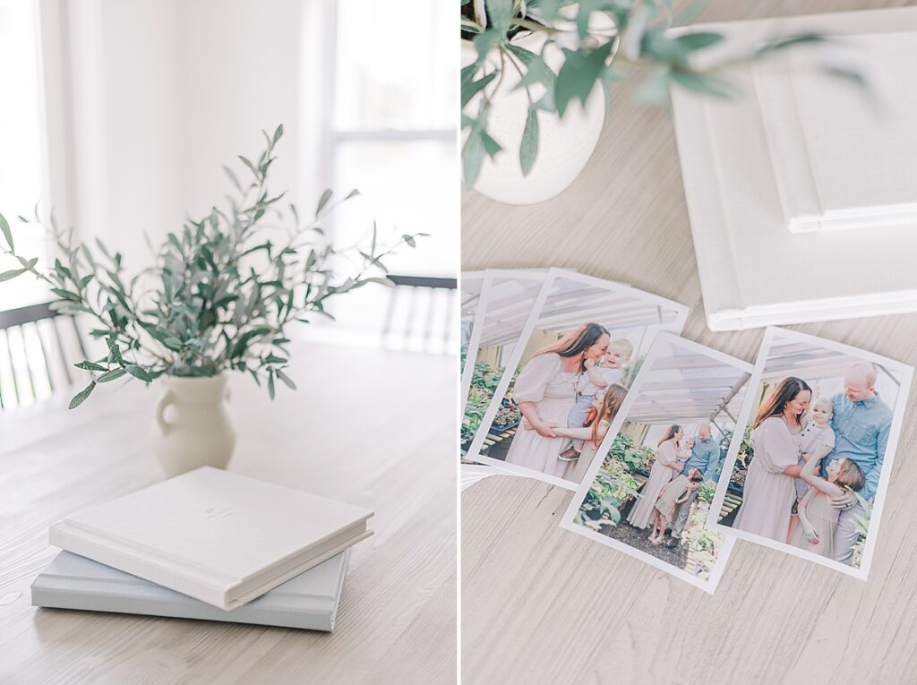 Augusta GA Family Photos - Printed portraits of a family are fanned out beside photo albums stacked on a table. 