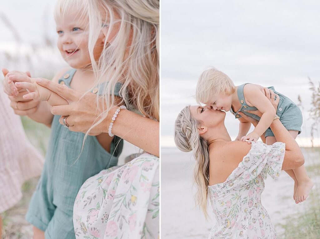 Evans GA Family Photographer - A mother kisses her son's cheek as she holds him up in the air and holds is hands together with hers. 